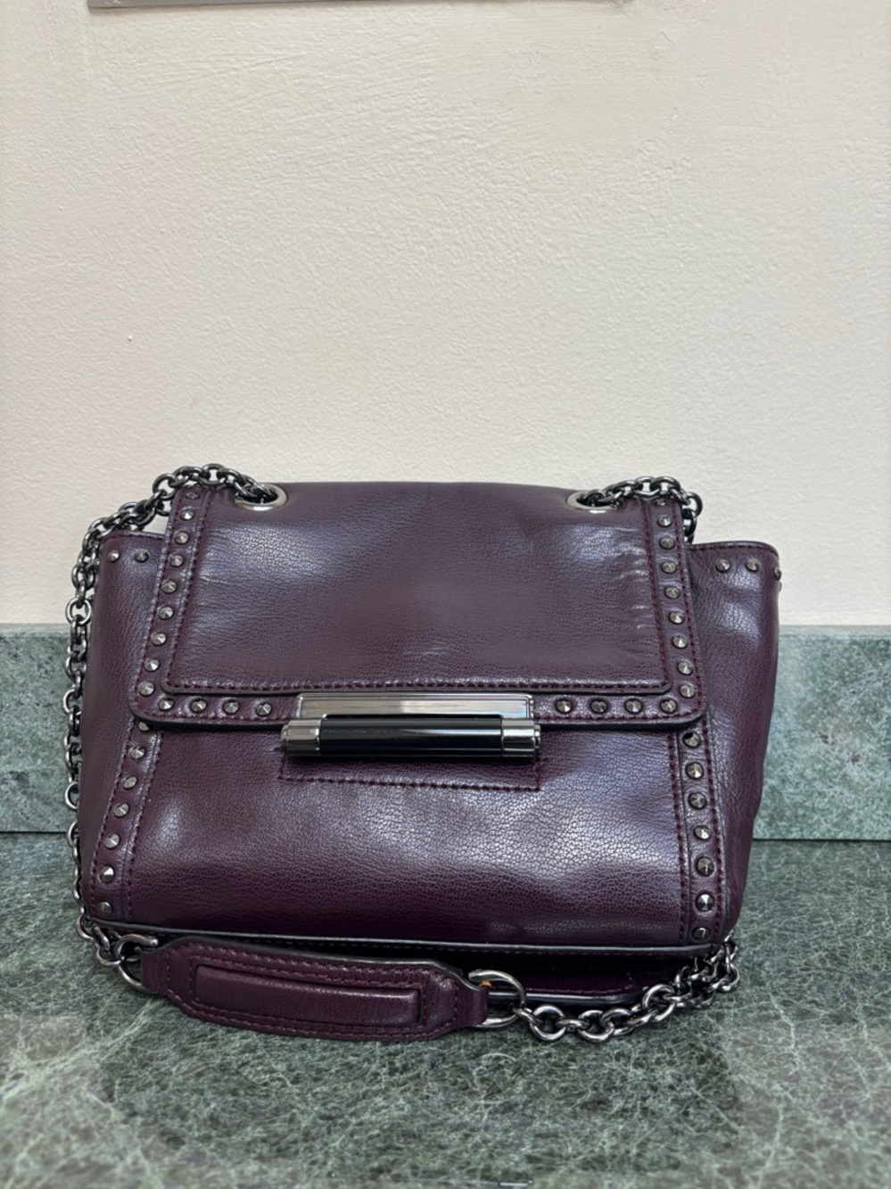 DVF vibrant dark purple 
cross body bag with gun metal hardware